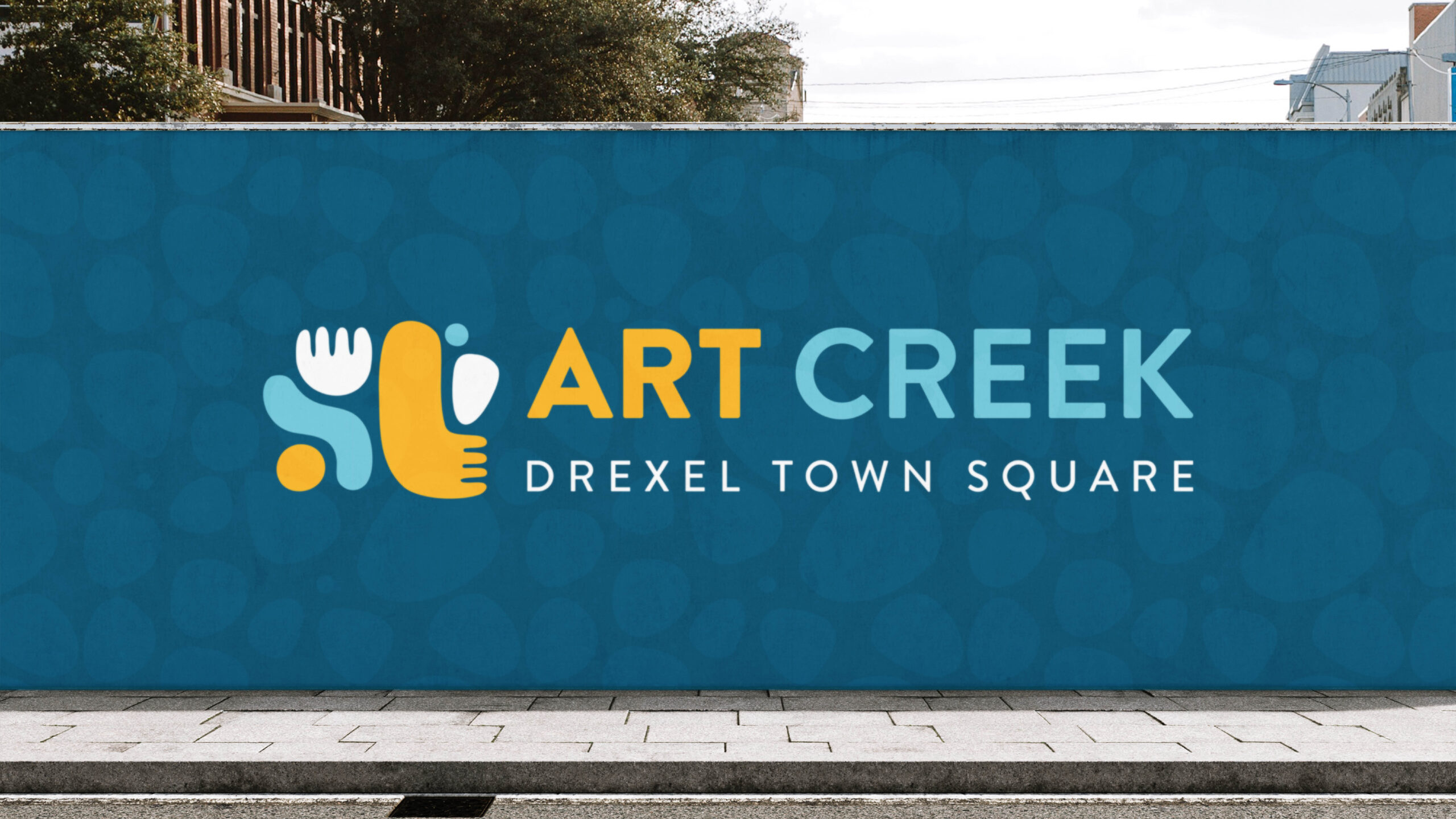 The City of Oak Creek's Art Creek event secondary logo street mural.